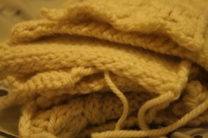 Pile of cream knitted swatches
